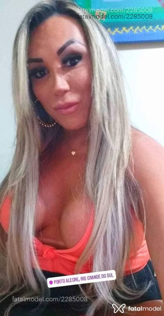 Acompanhante mulher trans loira (o) de olhos castanhos - Luciane Grimaldil
